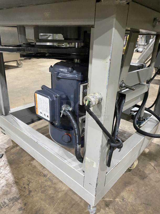 Benier commercial stainless steel conical dough rounder machine on casters, featuring robust construction and electrical components.