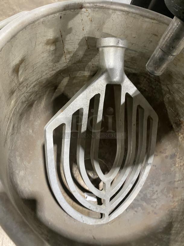 Hobart M802 commercial stainless steel mixer bowl with paddle attachment, showing signs of wear. Model M802, SN: 1317020.