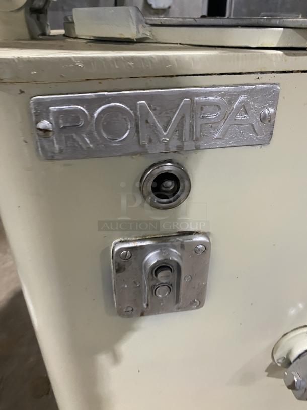 Rompa commercial electric dough rounder/divider with rounding plate, white, free-standing. Branded "ROMPA" plate visible.