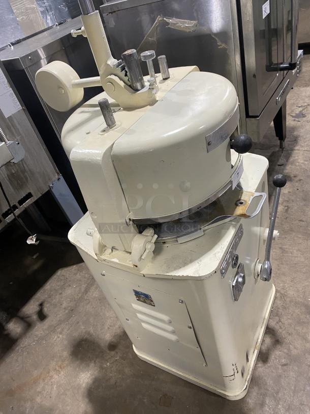 Rompa commercial white electric dough rounder/divider, free-standing model. Includes rounding plate, operational condition.