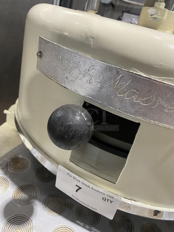 Rompa electric dough rounder/divider, white, free-standing, with rounding plate, visible wear, tag reads "Dough Master."