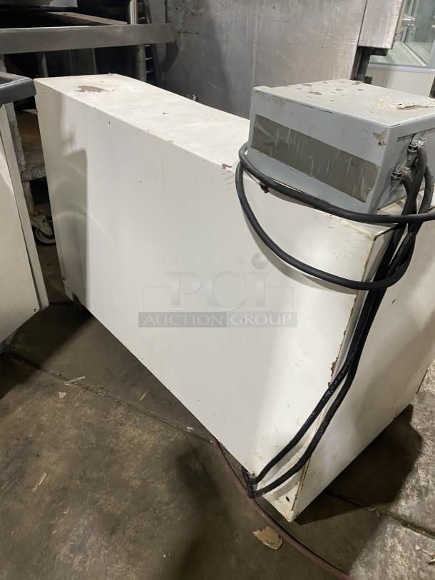 Merand Tenor 2 dough moulder, white, electric, countertop configuration. Visible wear and mounted control box with cables.