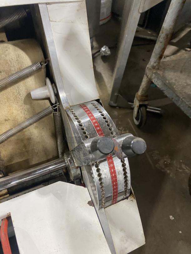 Merand Tenor 2 vertical dough moulder with electric power, worn condition, visible adjustment controls and springs.