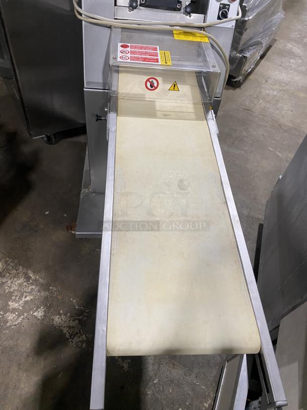 Minipan MOX dough sheeter, stainless steel, floor model with conveyor, on casters, 220V, 3 Phase, labels visible, SN: 2005087.