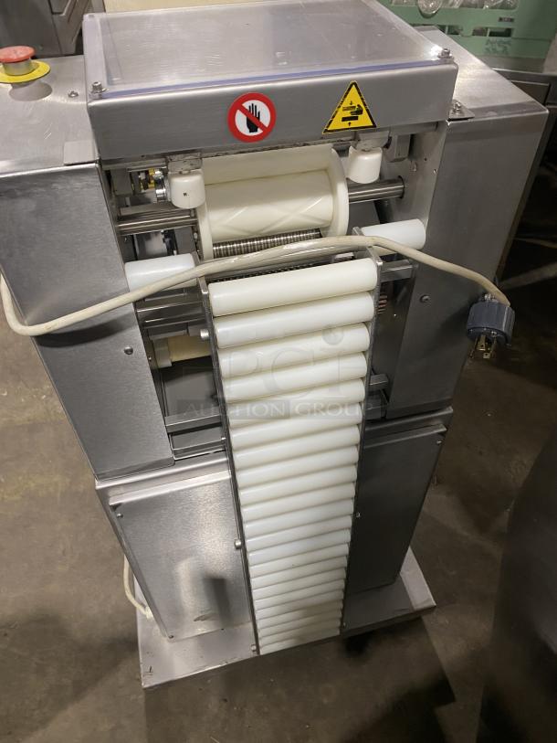 Minipan MOX commercial dough sheeter with conveyor, stainless steel, 220V 3-phase, on casters, safety labels visible.