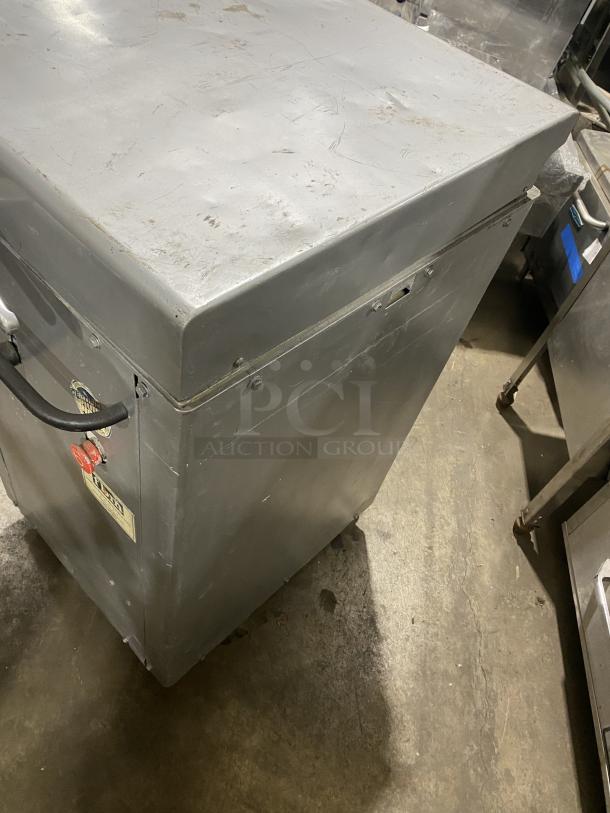 Panimatic commercial electric dough divider on casters, metal exterior, visible wear; ideal for bakeries.