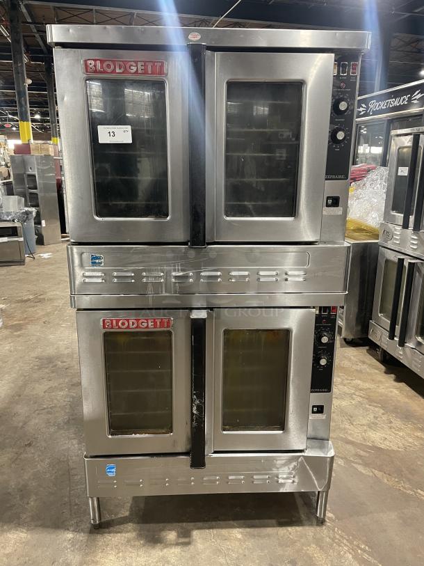 Blodgett commercial stainless steel double stacked gas convection oven, digital controls, wired racks, on legs, visible logo.
