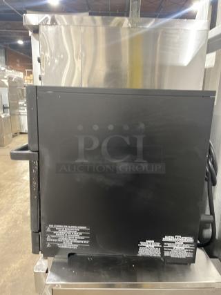 Merry Chef Eikon E2S Turbo Oven, 2022 model, countertop design, 208/240V, metal casing, visible safety labels, excellent condition.