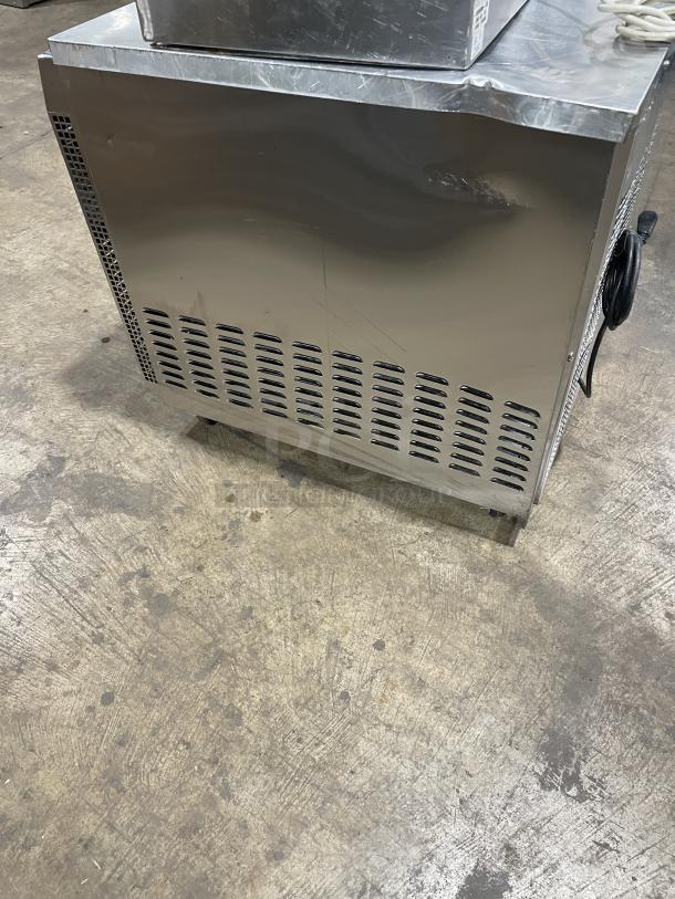 Continental CURB67 stainless steel 2-door cooler on casters, 115V, 1 phase, model SN:15052129. Minor surface wear.