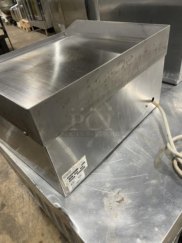 Croydon OR4E100001W5 stainless steel electric griddle with back and side splash, model SN: 822920, 110V, commercial use.