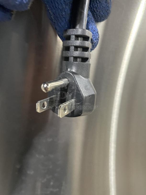 Close-up of power plug for Manitowoc stainless steel ice machine, Model SMS050A002, showing 115V compatibility.