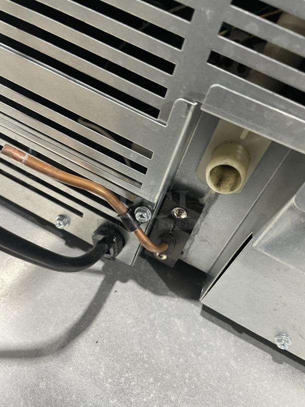 Manitowoc SMS050A002 ice machine, air-cooled, undercounter, stainless steel. SN: 310478076. Efficient 115V, 1 phase.