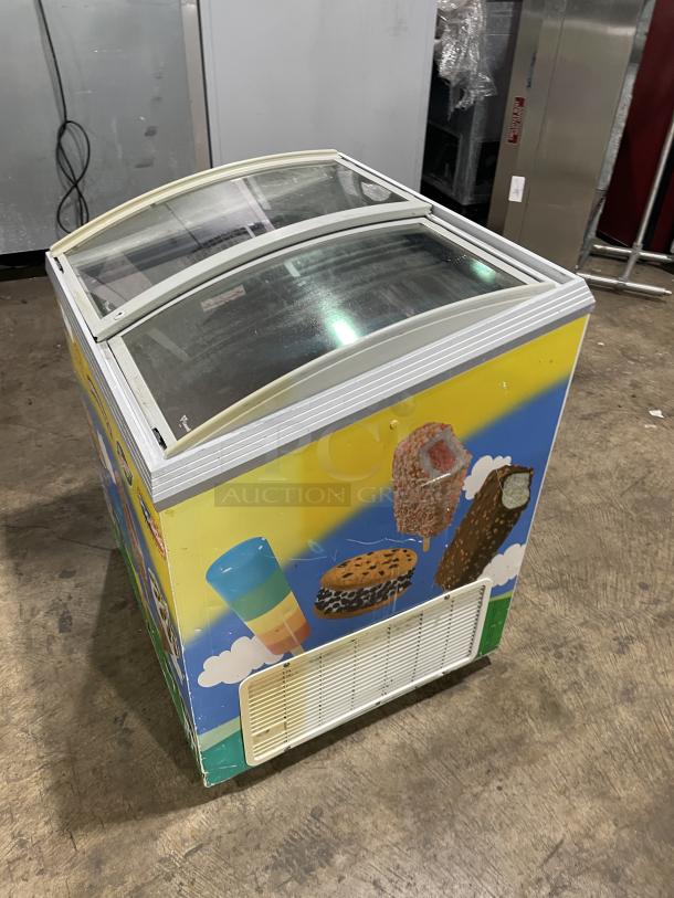 Caravell 206-995 commercial ice cream merchandiser freezer with colorful graphics, sliding glass lid, stainless steel exterior, 120V.