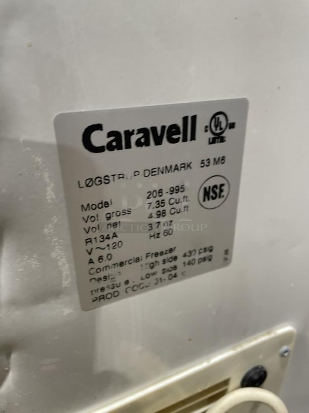 Caravell 206-995 stainless steel ice cream merchandiser freezer, top sliding glass lid, 120V. NSF certified label visible.