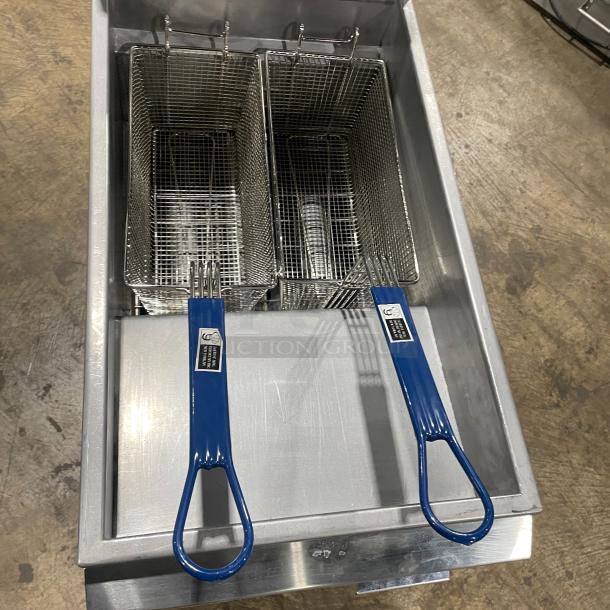 Asber stainless steel natural gas deep fat fryer with backsplash, basket hanger, fry basket, and casters.