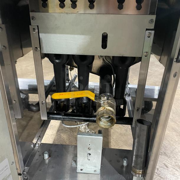 Asber stainless steel natural gas deep fat fryer with back splash, basket hanger, and fry basket. Features casters for mobility.