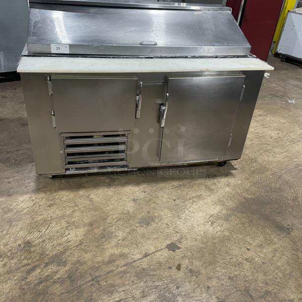 Commercial stainless steel 2-door refrigerated bain marie salad/sandwich prep table with cutting board, wired rack, and casters.