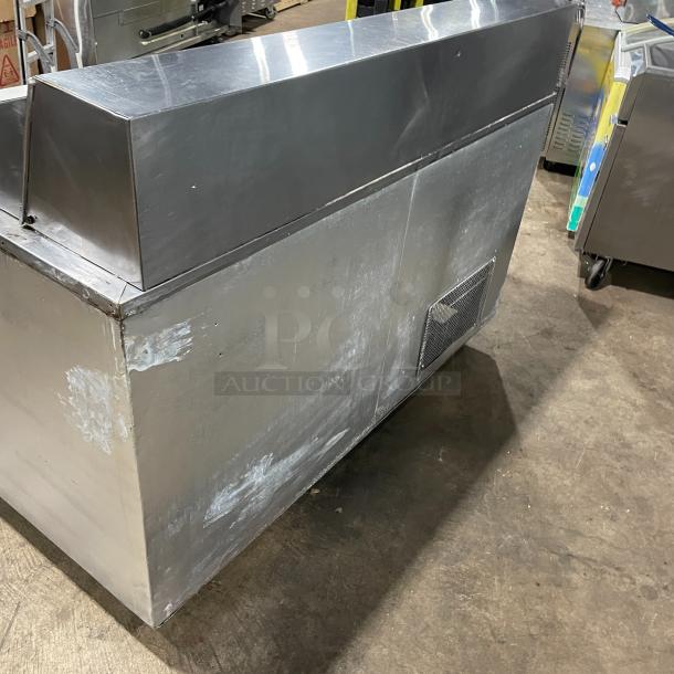 Commercial stainless steel 2-door refrigerated bain marie prep table with cutting board and poly-coated rack on casters.