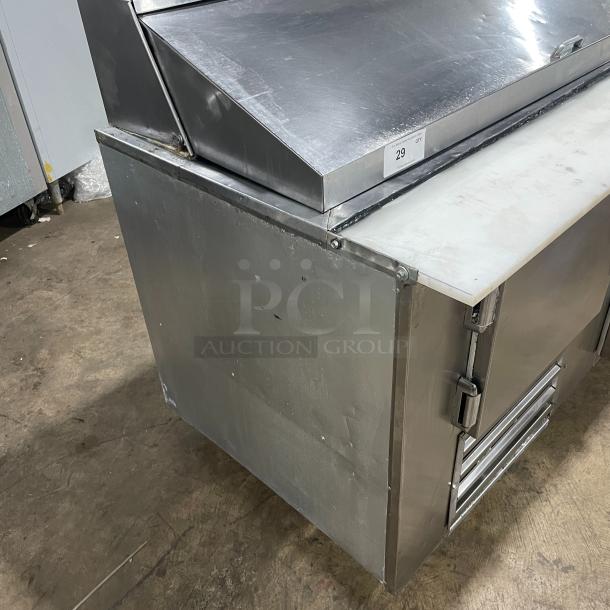 Commercial stainless steel 2-door refrigerated Bain Marie salad/sandwich prep table with cutting board, poly coated rack, on casters.