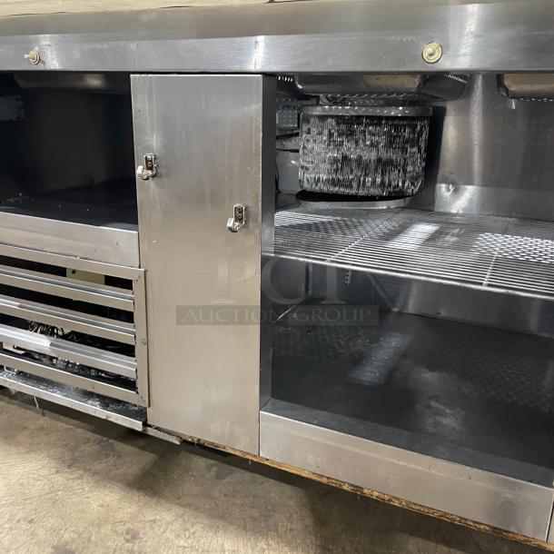 Commercial stainless steel 2-door refrigerated bain marie salad/sandwich prep table with cutting board and poly-coated wired rack on casters.