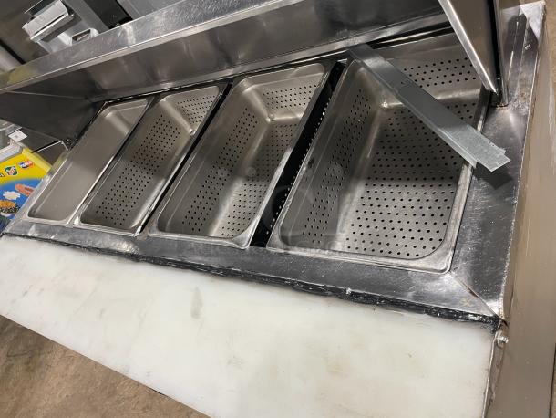 Commercial stainless steel 2-door refrigerated bain marie prep table with cutting board, poly-coated wire rack, on casters.
