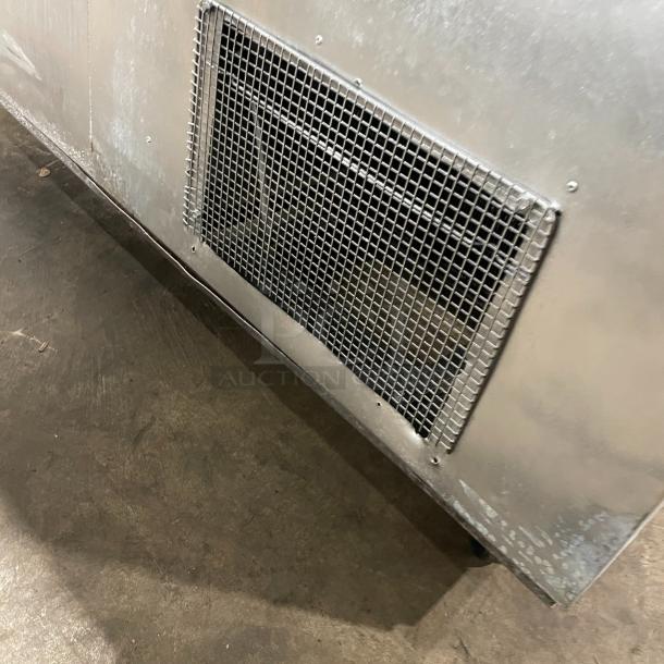 Commercial stainless steel 2-door refrigerated prep table with cutting board, poly coated wire rack, and casters.