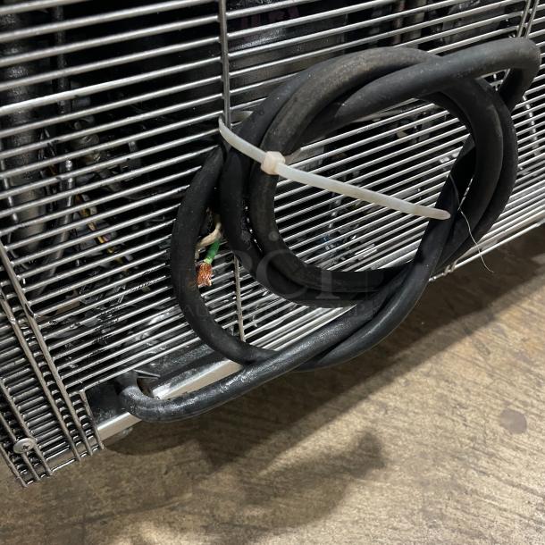 Turbo Air TST-28SD refrigerated salad/sandwich prep table on casters, stainless steel, visible electrical cords.