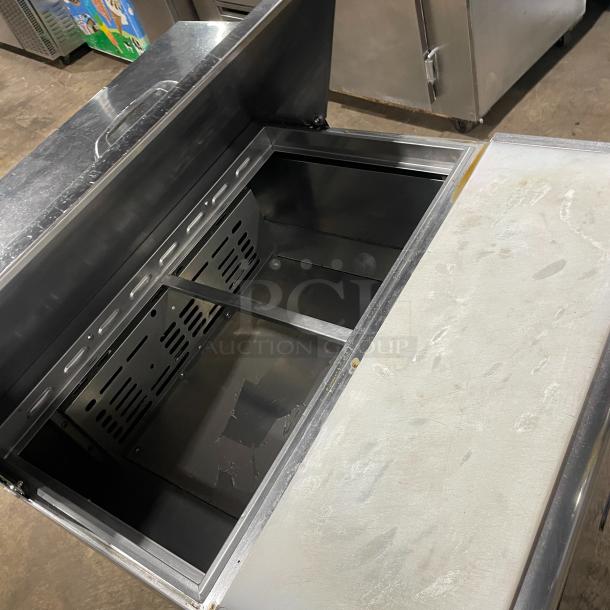 Turbo Air TST-28SD refrigerated prep table, stainless steel, single door, with cutting board, on casters, 115V.