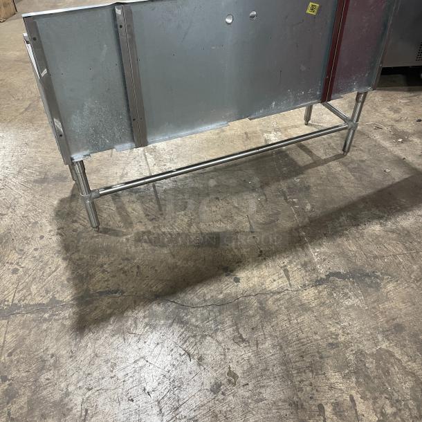 Eagle Group Spec-Bar 2000 Series stainless steel 60" 3-compartment underbar sink, model B5-3-LR-19, with side drain boards and backsplash, on legs.