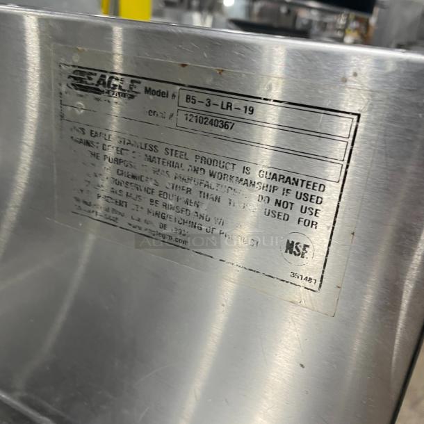 Eagle Group Spec-Bar 2000 stainless steel 60" underbar sink, model B53LR19. Features 3 compartments, left & right drain boards, backsplash, and leg support. Serial number 1210240367 indicated on label.