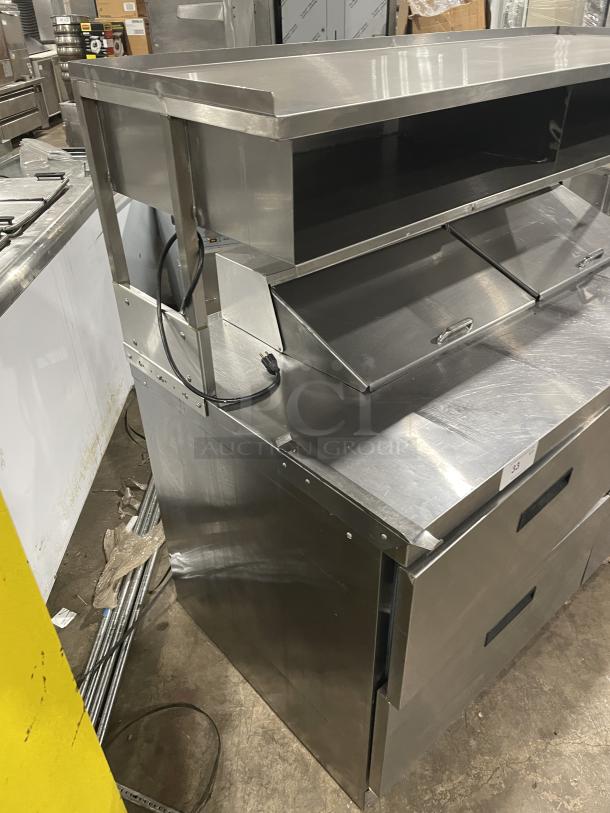Delfield stainless steel 4-drawer refrigerated prep table, model UCD4464N12DD5. Features enclosed overhead shelf, 115V, 1 phase.