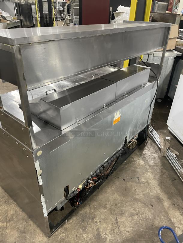 Delfield UCD4464N12DD5 stainless steel 4-drawer refrigerated prep table with overhead shelf, used condition, 115V, 1 Phase.