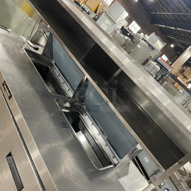 Delfield UCD4464N-12-DD5 stainless steel prep table with 4 drawers and overhead shelf, commercial-grade, 115V, excellent condition.