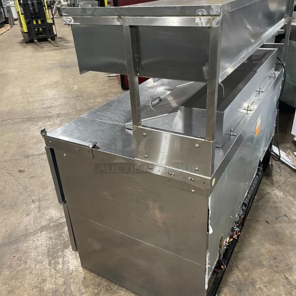 Delfield stainless steel 4-drawer refrigerated prep table, Model UCD4464N-12-DD5, with overhead shelf, 115V, 1 phase.