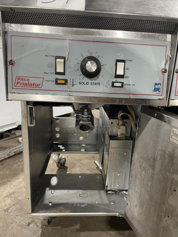 Pitco Frialator stainless steel 2-bay fryer system with control panel, enclosed pan cabinet, basket hanger, and casters.