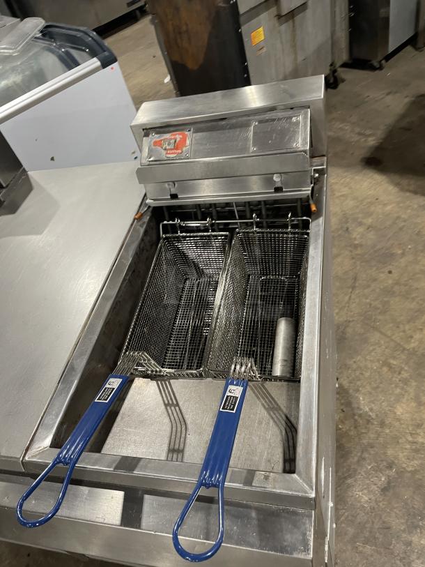 Pitco Frialator Series commercial stainless steel 2-bay deep fat fryer with enclosed pan cabinet, backsplash, and fry baskets.