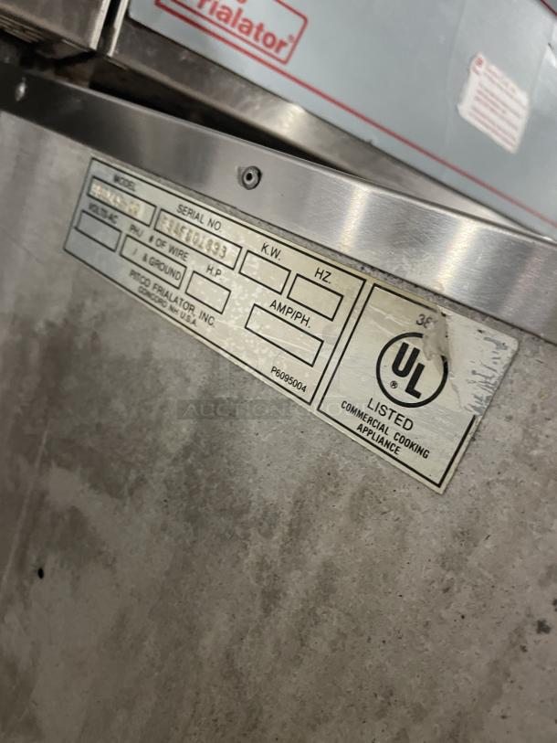 Pitco Frialator 2-Bay Deep Fat Fryer, stainless steel, with enclosed pan cabinet, basket hanger, backsplash, on casters.