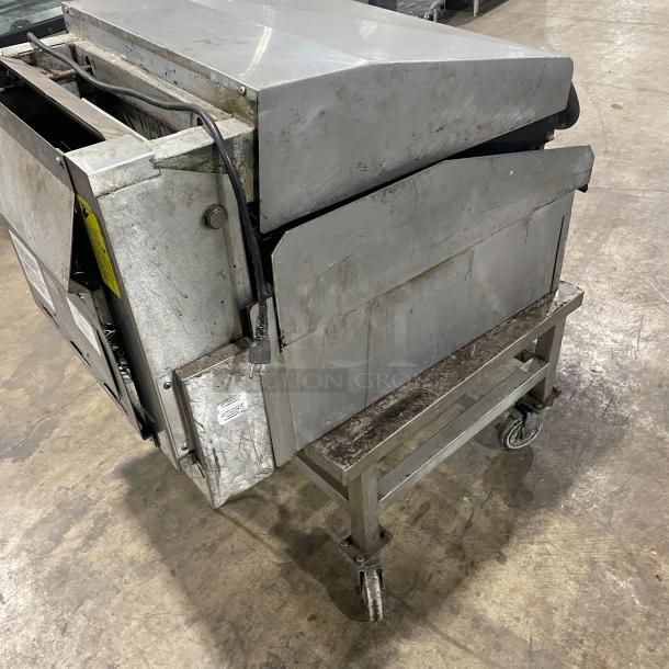 Lang 224TH-NATMG stainless steel infrared clamshell griddle with stand, natural gas powered, on casters, used condition.
