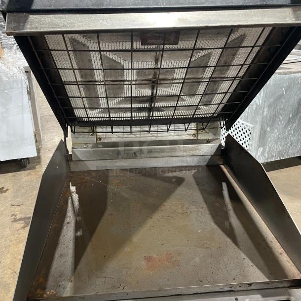 Lang 224TH-NATMG stainless steel infrared clamshell griddle on casters, natural gas powered, includes equipment stand/cart.