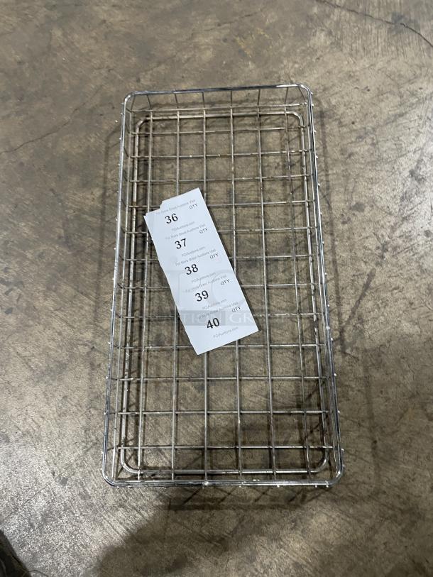 Commercial stainless steel bagel/bread display basket, wire construction, good condition, with auction tags visible.