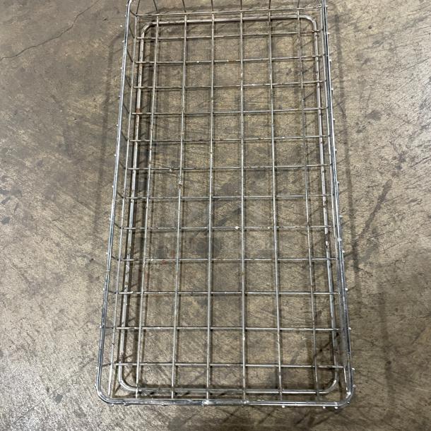 Commercial stainless steel bagel/bread display basket, rectangular, grid pattern, used condition, no visible markings.