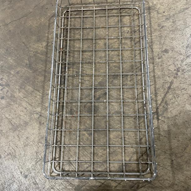 Commercial stainless steel bagel and bread display basket, grid design, sturdy, in good condition. Ideal for bakery use.