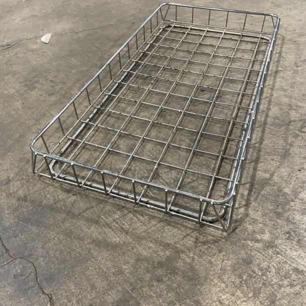 Commercial stainless steel bagel/bread display basket, wire grid design, excellent condition, ideal for retail use.