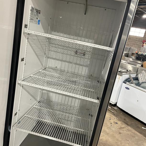 True T-23F commercial stainless steel one-door reach-in freezer, 115V, 1 phase, on casters, with interior shelving. Model: T-23F, SN: 7887234.