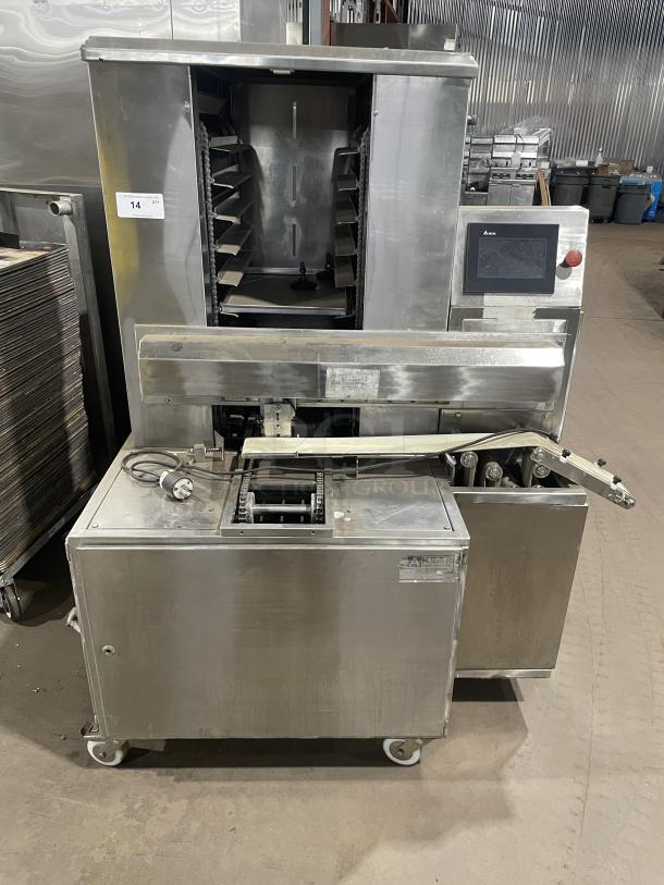 Aksar floor style heavy-duty commercial tray wrapping machine, stainless steel, with control panel and caster wheels, model number visible on label.