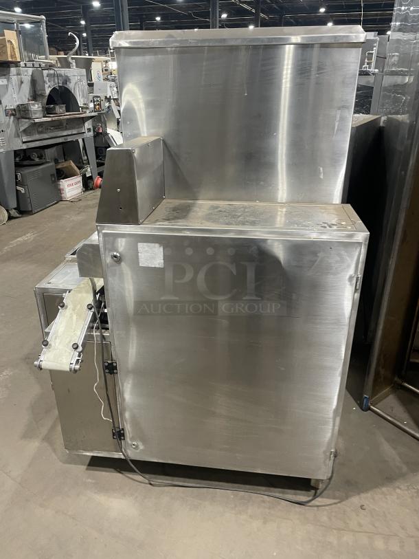 Aksar commercial tray wrapping machine in stainless steel, heavy-duty floor style, industrial condition, visible wiring.