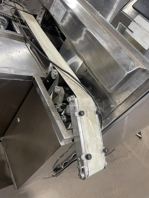 Aksar heavy-duty commercial tray wrapping machine, stainless steel, floor style, used condition, with conveyor belt.