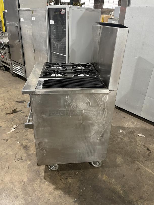 Jade Range gas-powered 4 burner char broiler combo with full-size oven, on commercial casters, visible wear, industrial setting.