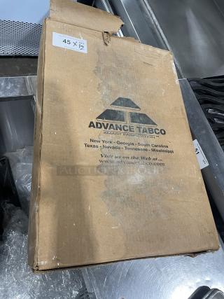 Brand new Advance Tabco full-size baking sheet pans in cardboard box, 12 pieces per bid. Box shows "45 X" and "QTY 2".