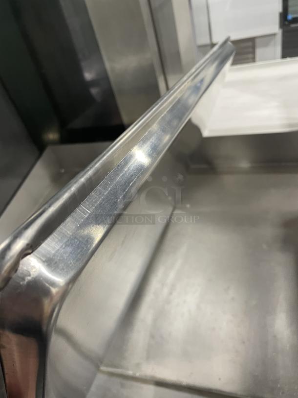 Brand new Advance Tabco full-size baking sheet pan, stainless steel, detailed corner view, pristine condition.